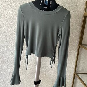 Cropped long bell sleeve